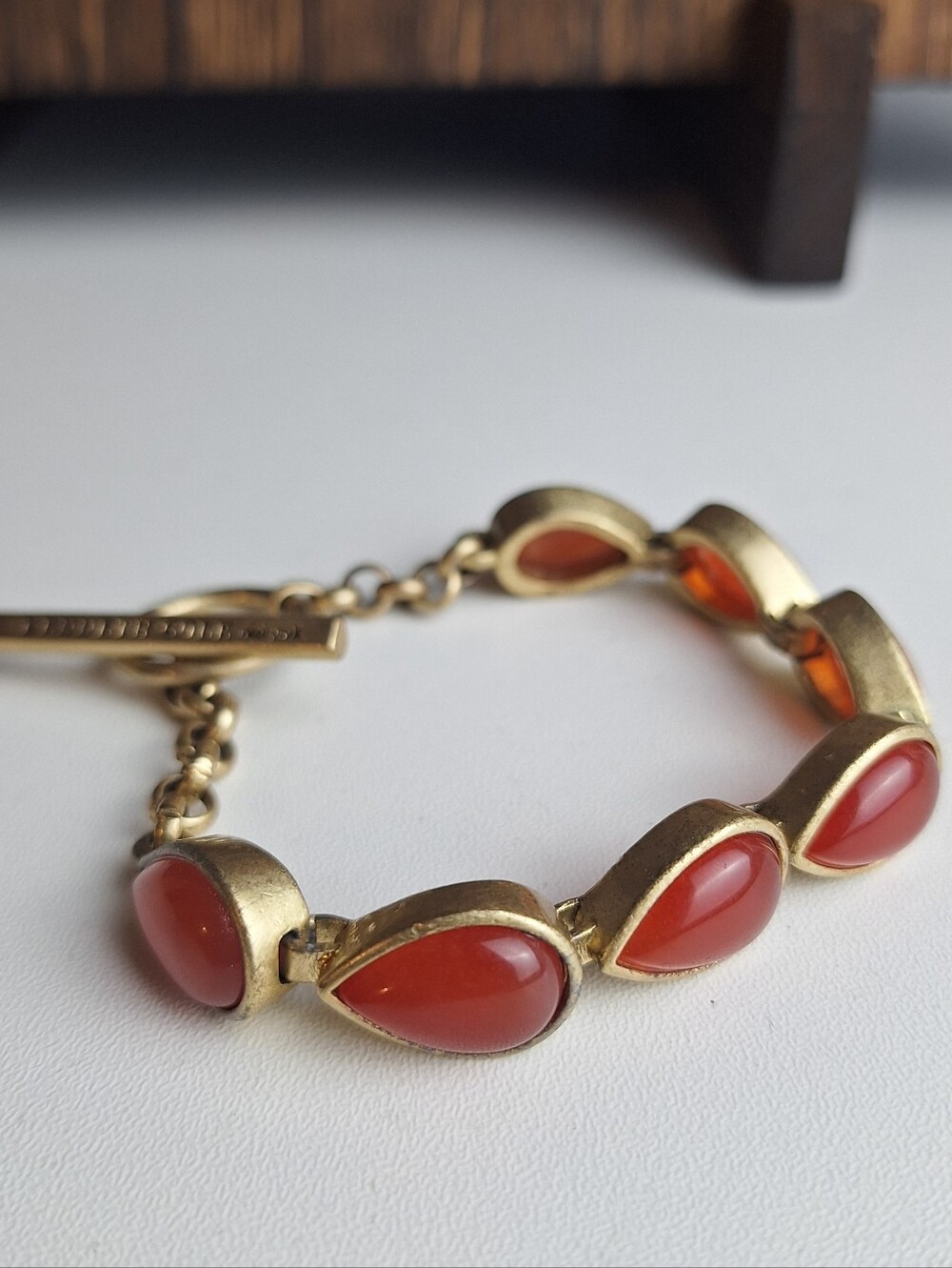Kenneth Cole Goldtone Toggle Bracelet Teardrop Red/Coral glass Faux Gemstones